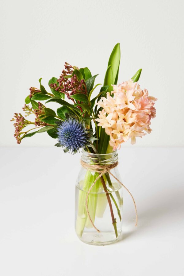 A simple bud vase with a few flower stems makes a great gift!